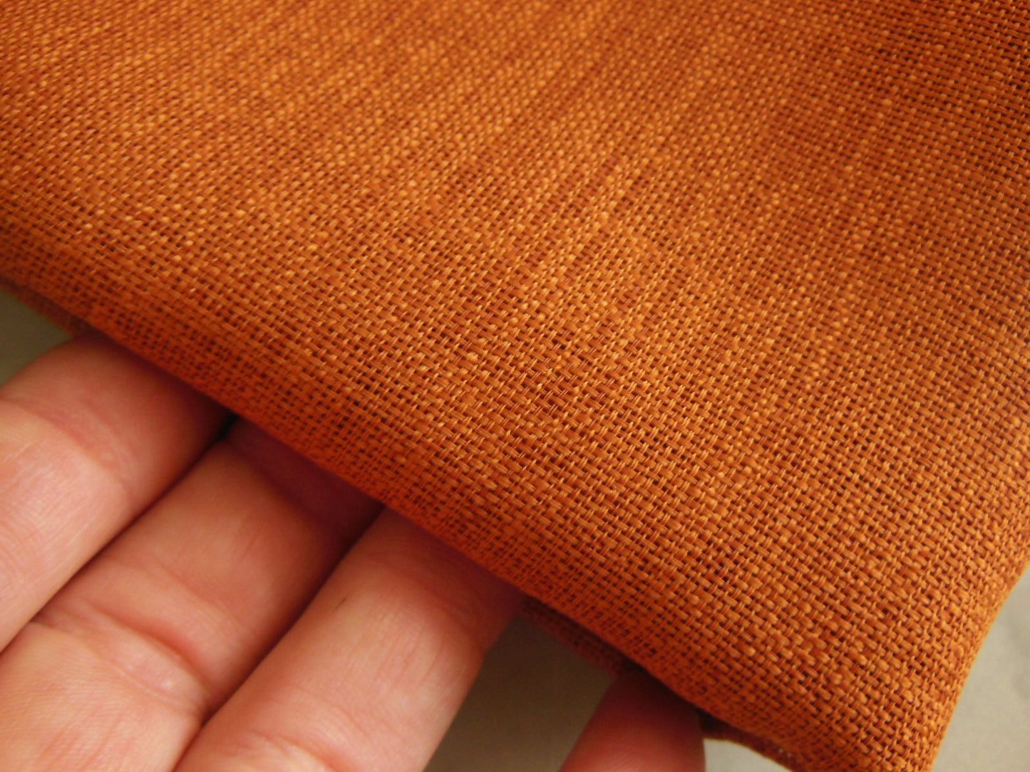 Coupon tissu trame apparente orange brulé rouille 1 m07 sur 87 cm