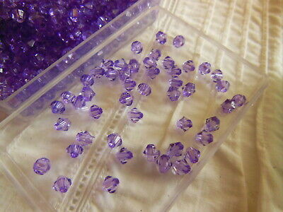 Lot environ 12 grammes de perles de toupie acrylique violet 3 mm  n°91