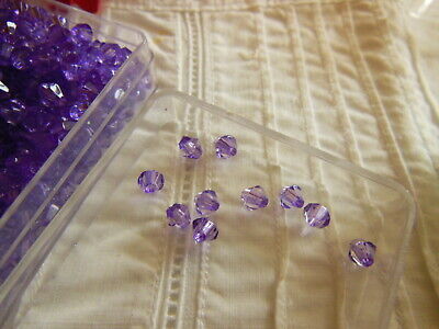 Lot environ 12 grammes de perles de toupie acrylique violet 3 mm  n°91