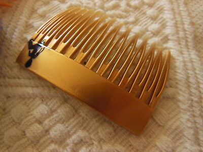 Ancien peigne vintage doré motif noir  combs jamais utilisé 