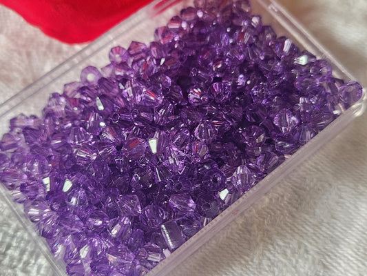 Lot environ 12 grammes de perles de toupie acrylique violet 3 mm  n°19