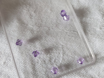 Lot environ 12 grammes de perles de toupie acrylique violet 3 mm  n°19
