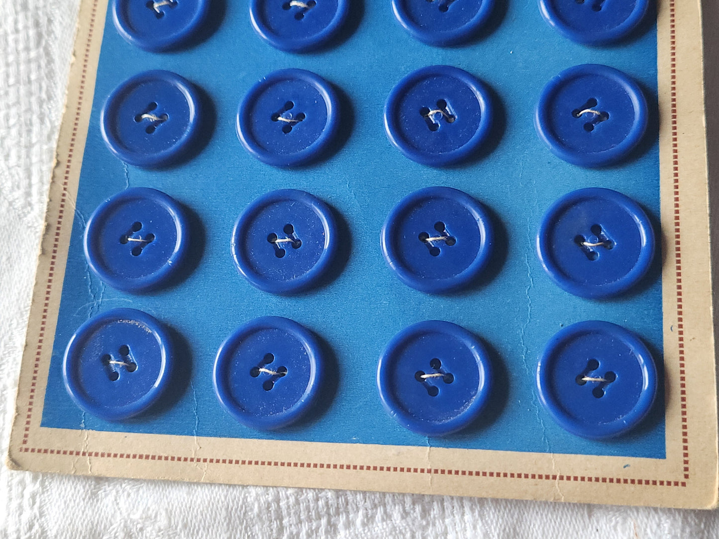 Plaque lot de 24 boutons vintage bleu 2 cm trous