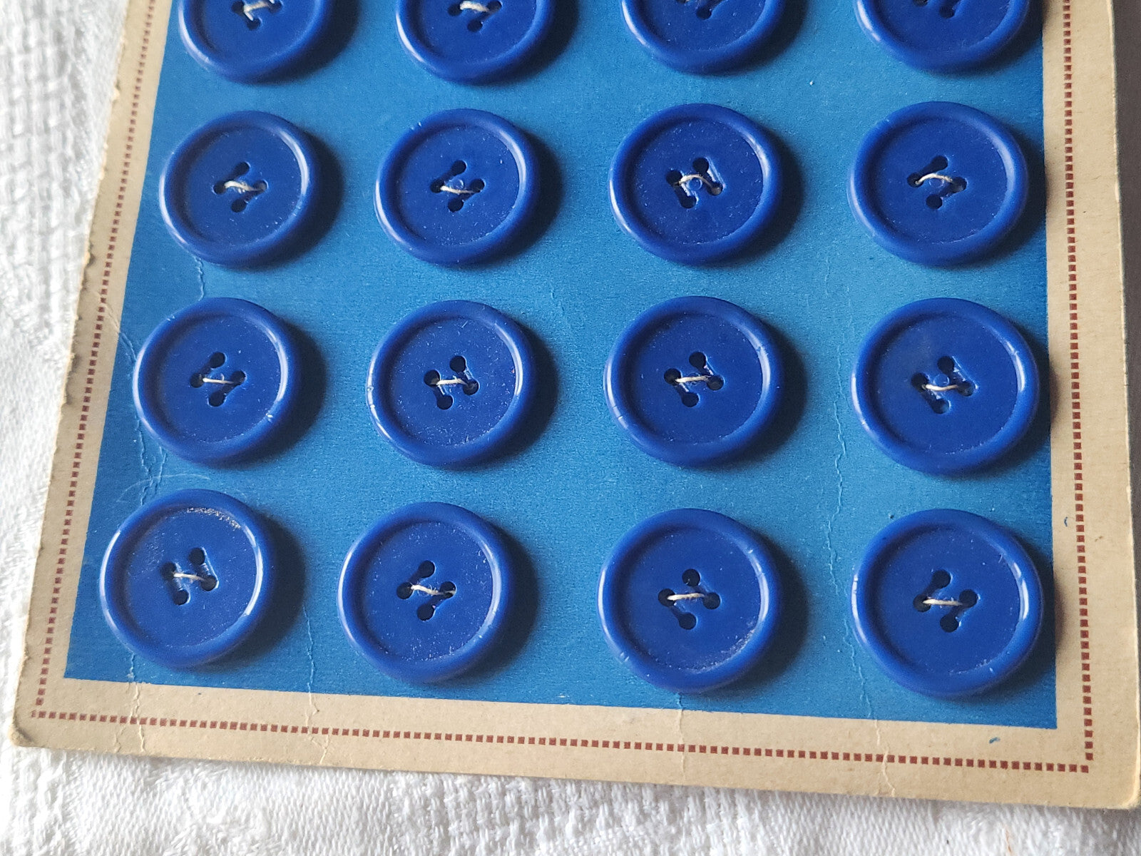 Plaque lot de 24 boutons vintage bleu 2 cm trous