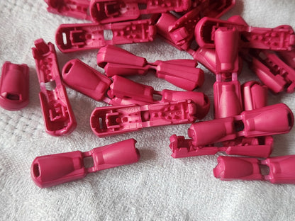 Lot 20 stop cordons rose taille fermé: 1, 4 cm ouvert 3 cm année 90 ref 5699